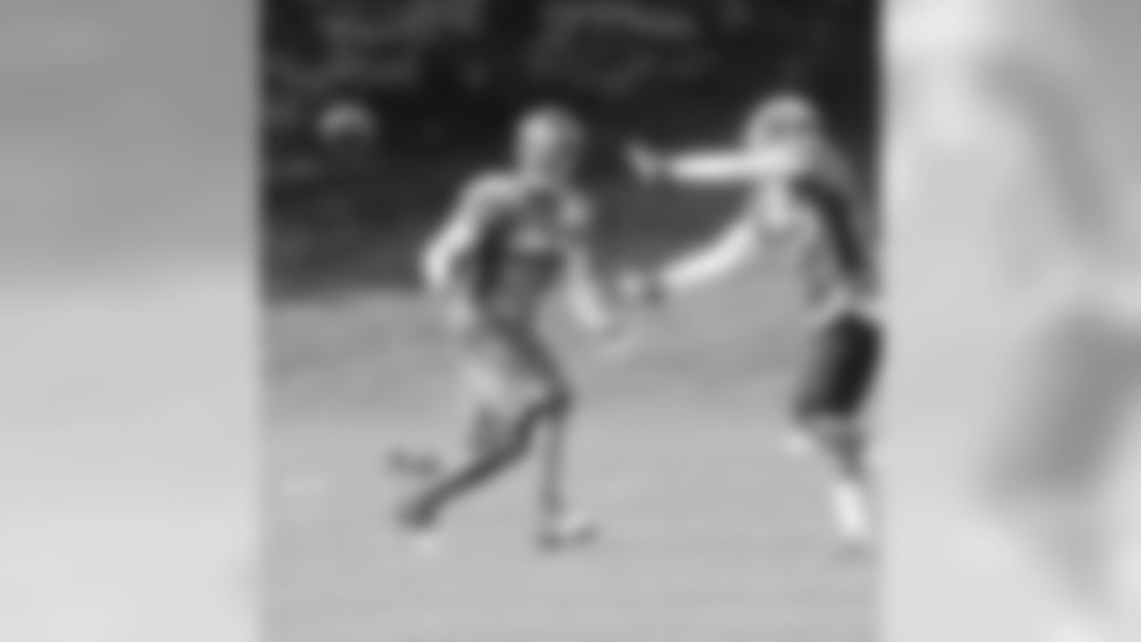 Bailey focuses on the ball with Harris trying to distract him.