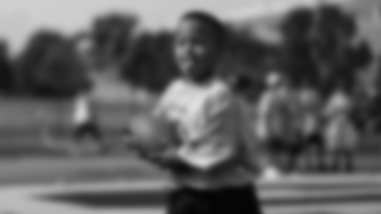 Emmanuel Sanders interacts with children at his youth football camp at Thomas Jefferson High School in Denver on July 1, 2019.