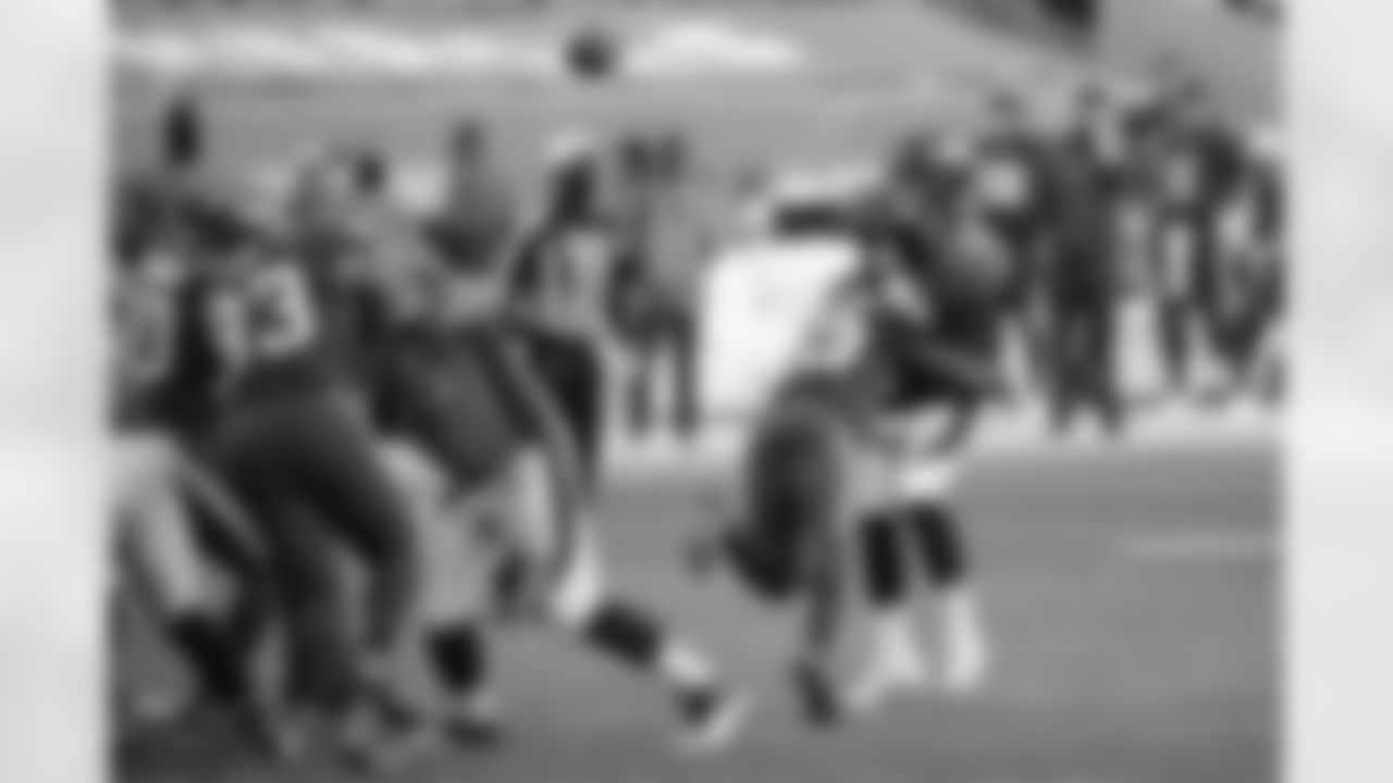 Brett Rypien is hit by safety Jordan Whitehead (33) as he throws a pass during the second half of the Broncos' Week 3 game against the Tampa Bay Buccaneers at Empower Field at Mile High on September 27, 2020. (Photo by Ben Swanson)