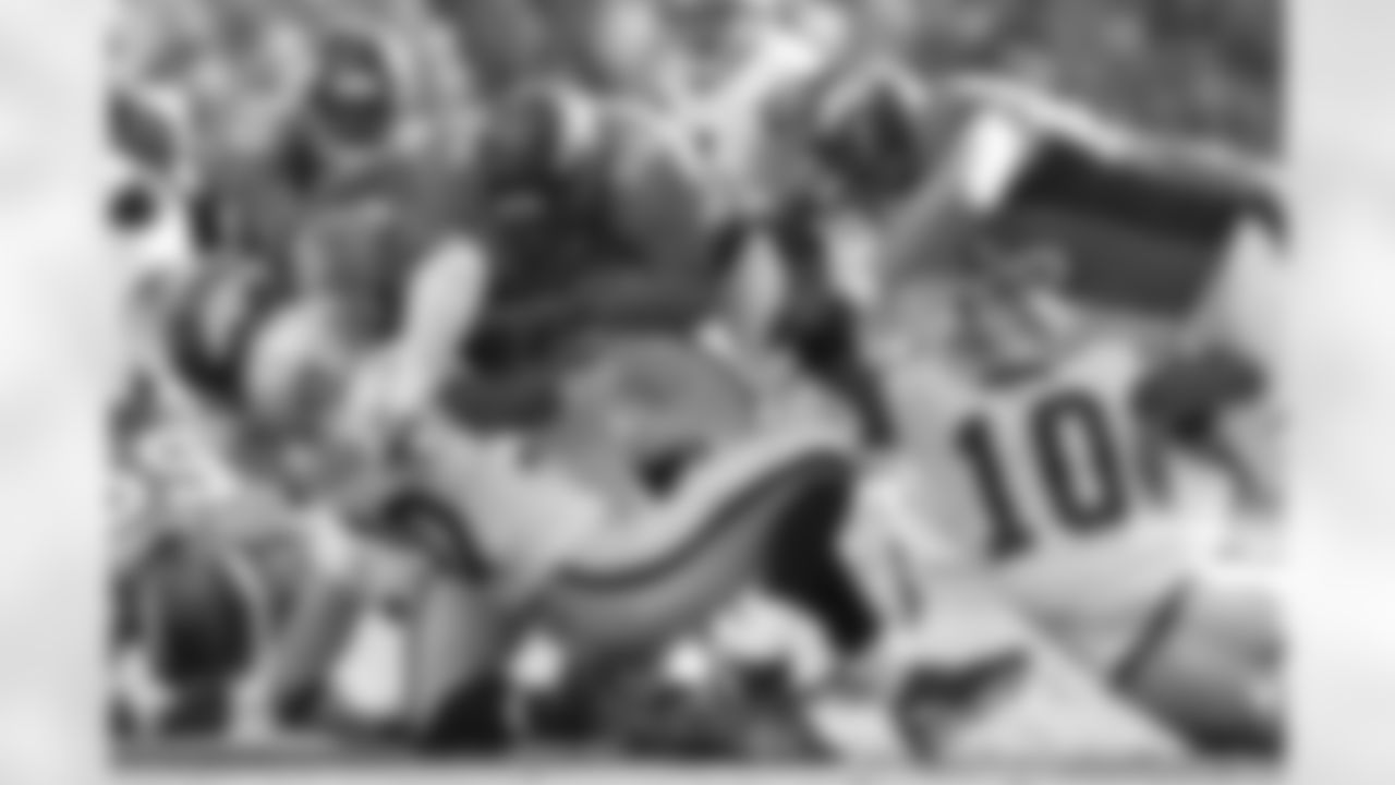 Broncos defenders swarm McFadden, who averaged just 2.6 yards per carry in the game.