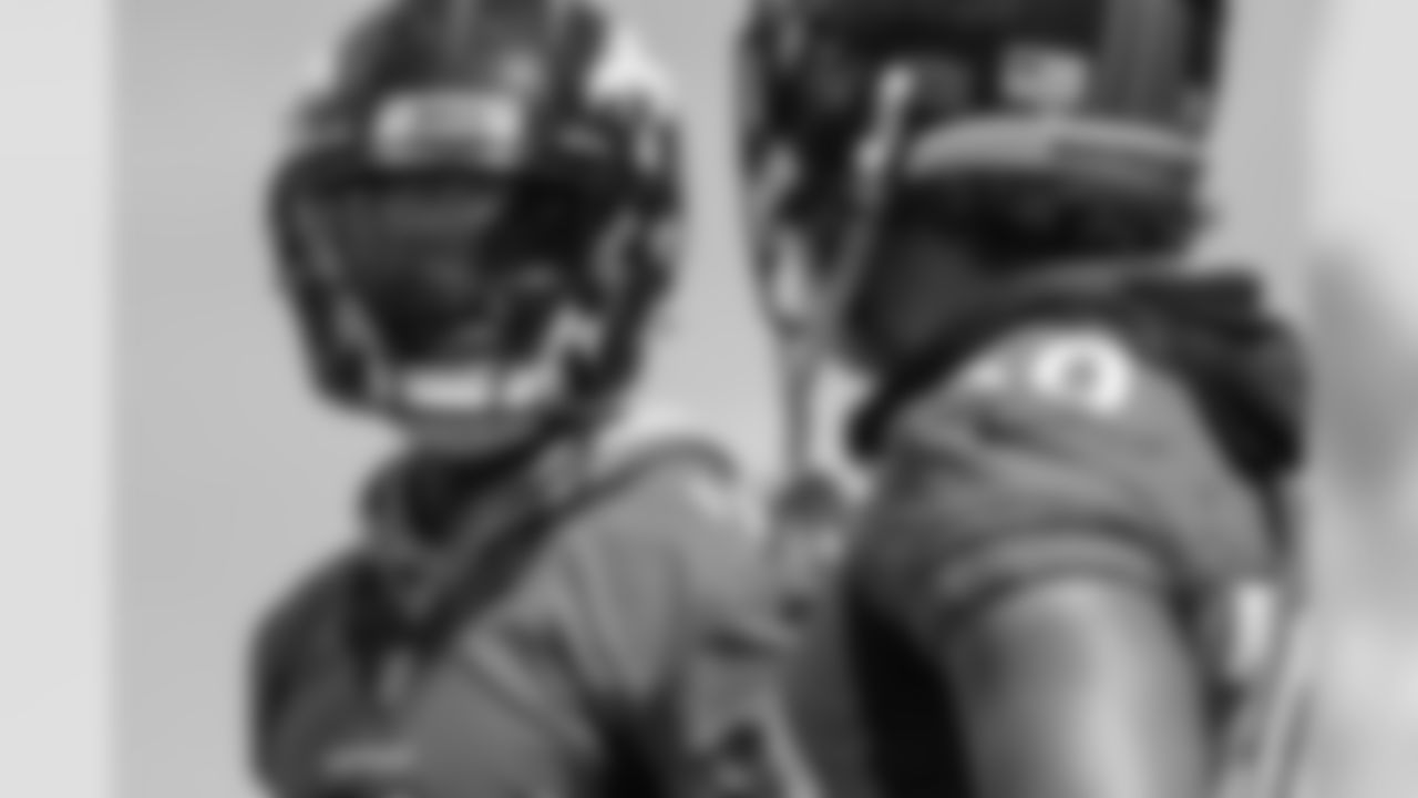 Diontae Spencer smiles as he talks with Phillip Lindsay during practice at UCHealth Training Center on August 12, 2020. (Photo by Ben Swanson)