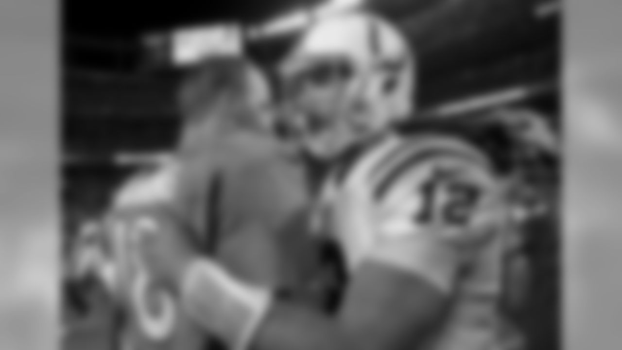 Denver Broncos quarterback Peyton Manning (18) and Indianapolis Colts quarterback Andrew Luck (12) hug after the game against the Indianapolis Colts during the preseason game at Sports Authority Field at Mile High in Denver, CO, 9 07, 2014.
Photo by Gabriel Christus