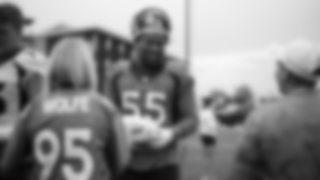 Bradley Chubb signs autographs for military members from the USAA Salute to Service NFL Boot Camp after practice on August 21, 2019 at UCHealth Training Center.