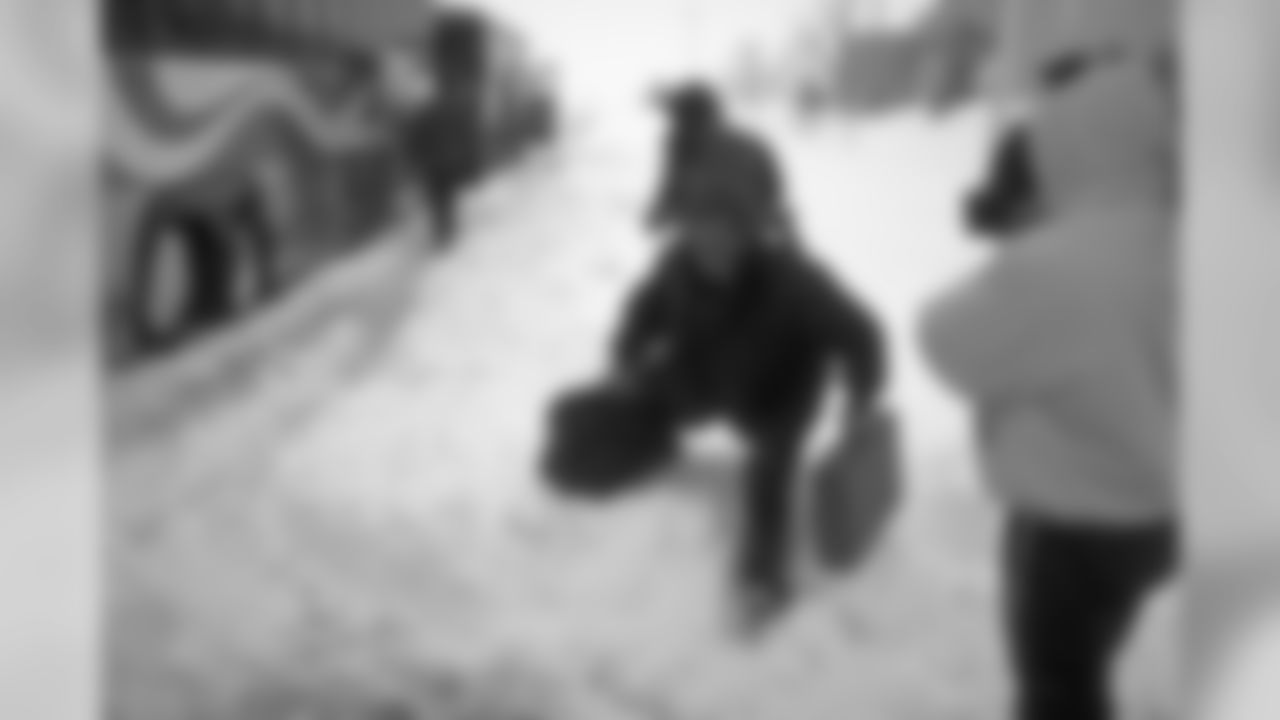 Denver: Mike Shanahan fights his way through snow to get to the team bus during the blizzard against the Buffalo Bills at Rich Stadium in Orchard Park, NY on October 26, 1997.