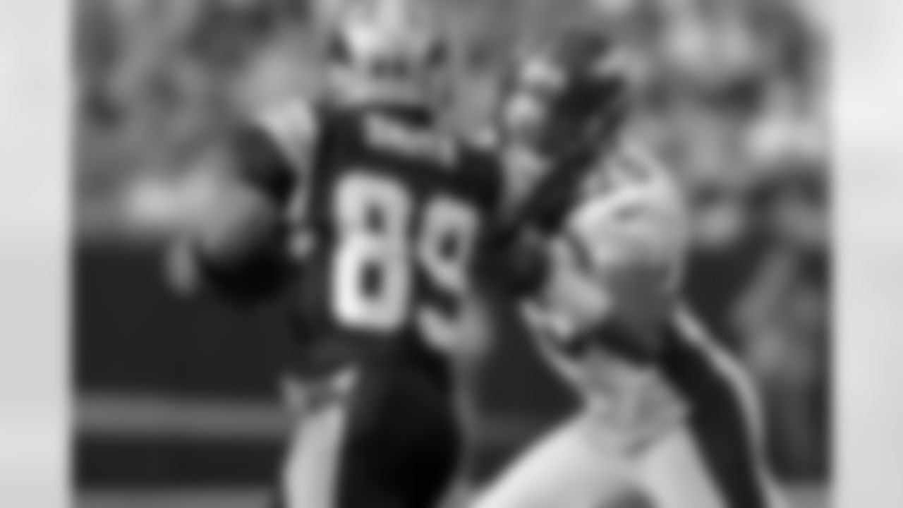 CB Chris Harris looks to bring down Panthers WR Steve Smith.