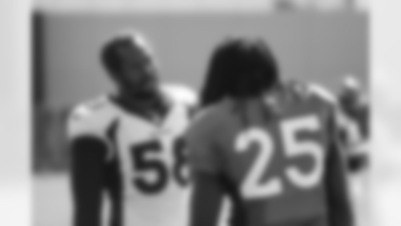 Von Miller talks with Melvin Gordon III during the 14th day of training camp at UCHealth Training Center on September 1, 2020. (Photo by Ben Swanson)