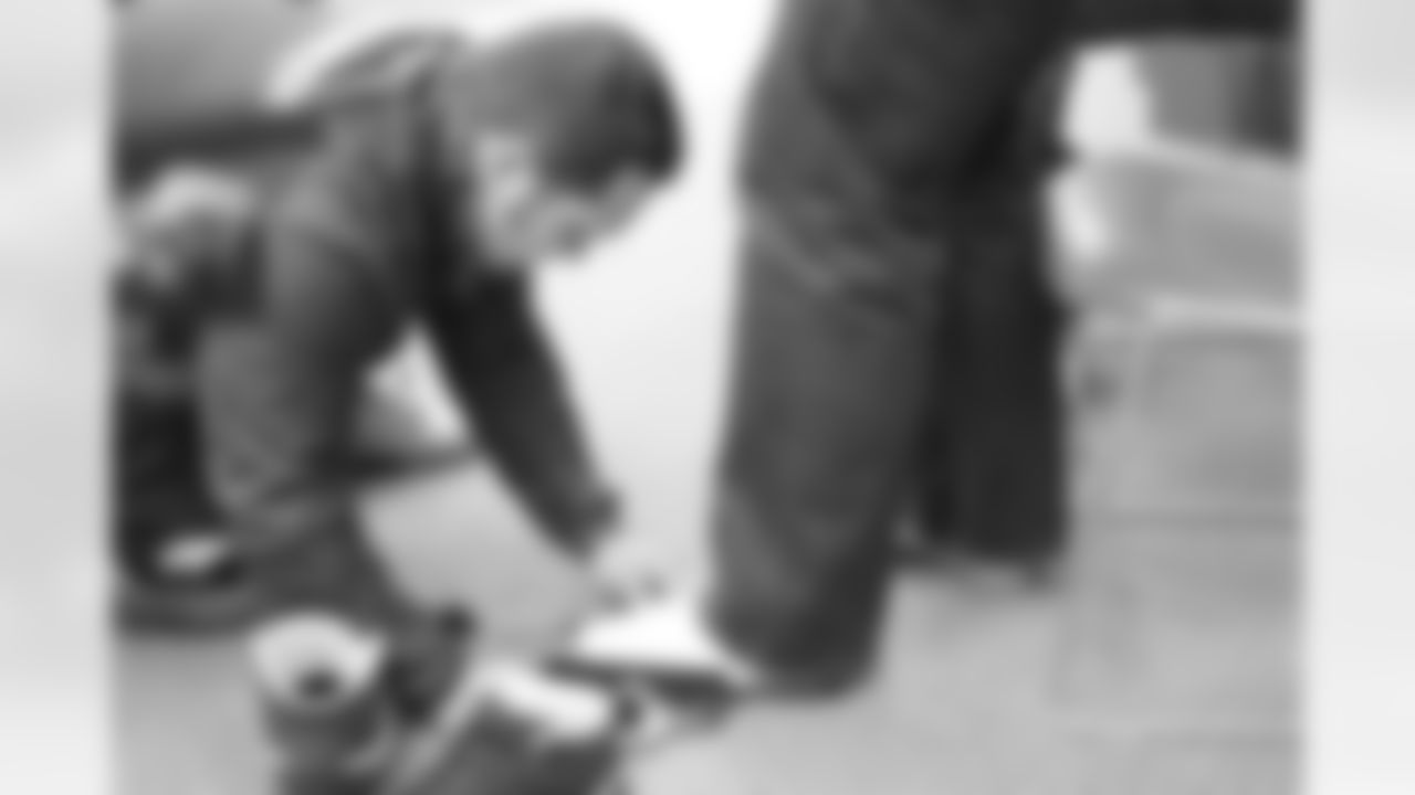 Harrington checks Paradis' shoe size.