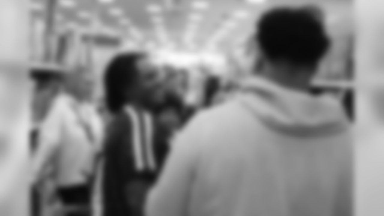 Todd Davis and Elijah Wilkinson share a laugh during Will Parks' shopping spree for the Boys & Girls Club of Metro Denver on Dec. 3, 2018