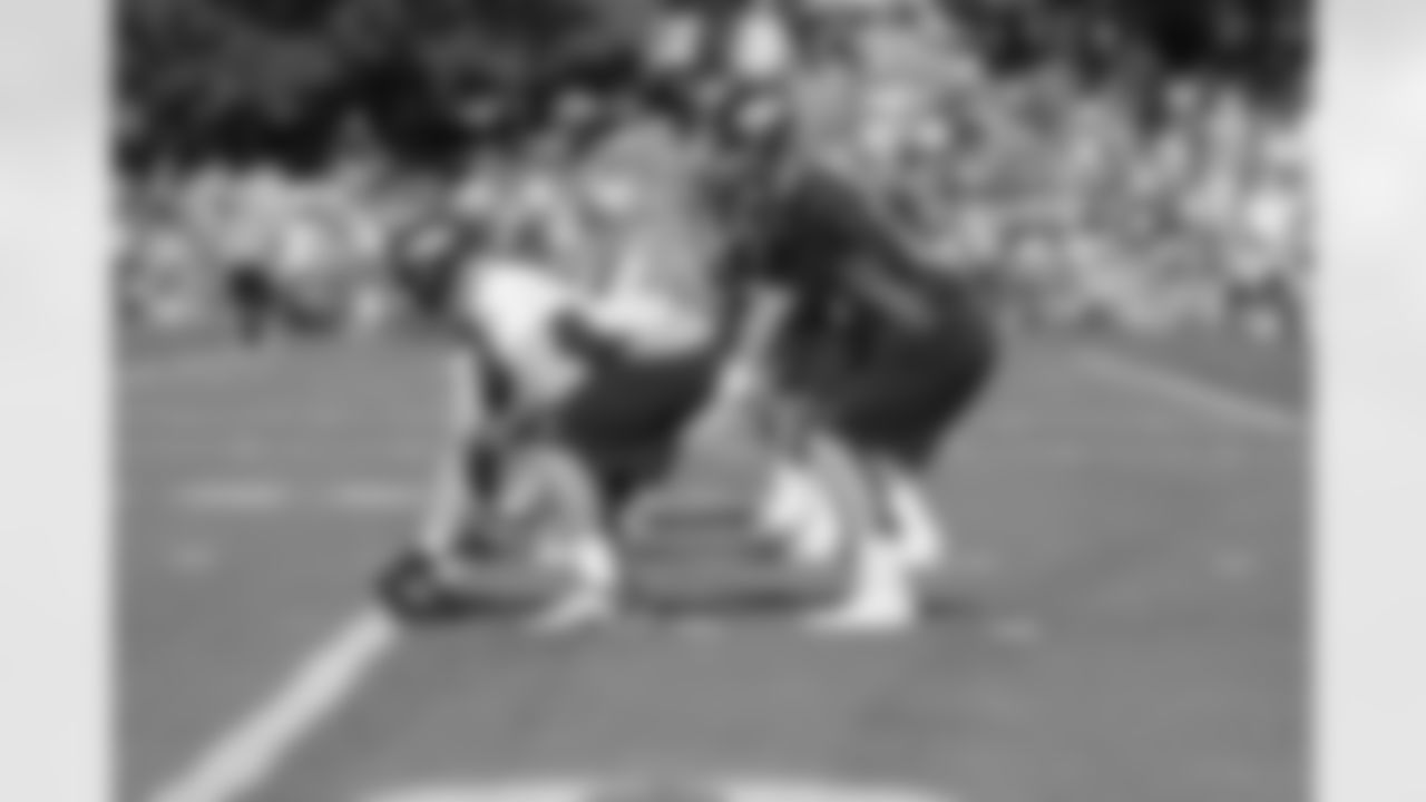 The centers and quarterbacks practice the exchange.
