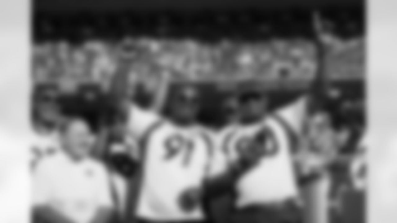 Alfred Williams and Neil Smith during a halftime show celebrating the 25th anniversary of the 1998 Super Bowl XXXIII-winning Broncos team at the Broncos' Week 2 game against the Washington Commanders at Empower Field at Mile High in Denver, Colorado on September 17, 2023. Photo by Gabriel Christus / Denver Broncos