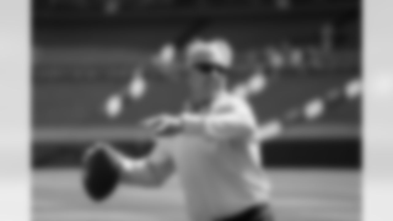 Peyton Manning throws a football with John Elway while they conduct an interview during the taping of an episode of Peyton's Places at Empower Field at Mile High on June 26, 2020. (Photo by Ben Swanson)