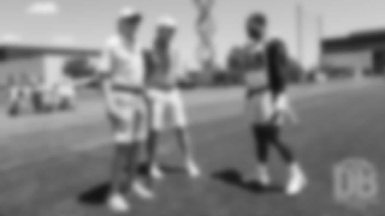 Archie and Peyton Manning chat briefly with Von Miller during the Broncos' second mandatory minicamp practice on June 5, 2019.