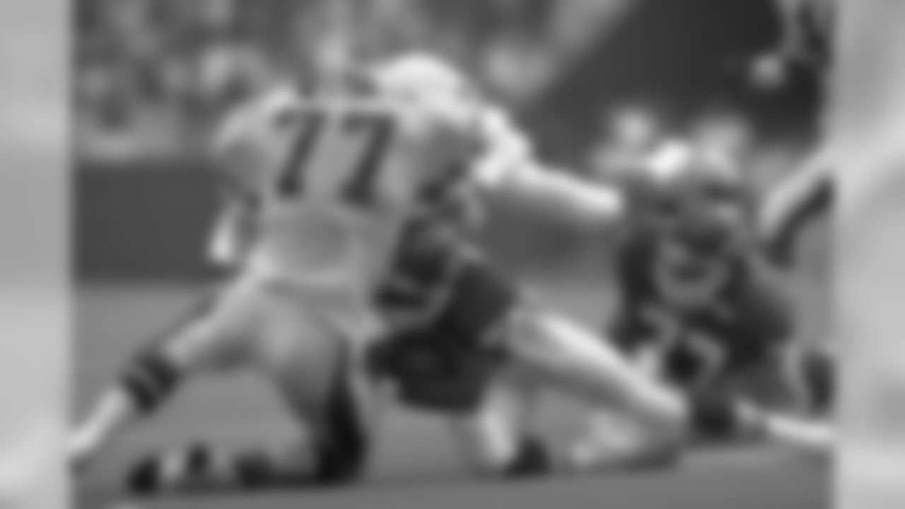 Linebacker Karl Mecklenburg stuffs a Chiefs ball carrier during a game in Kansas City.