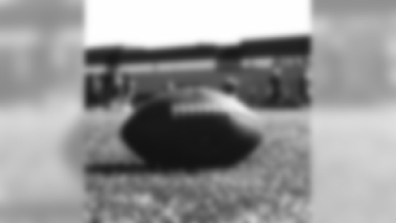 A football lies on the ground at a 2019 training camp practice. (Photo by Gabriel Christus)