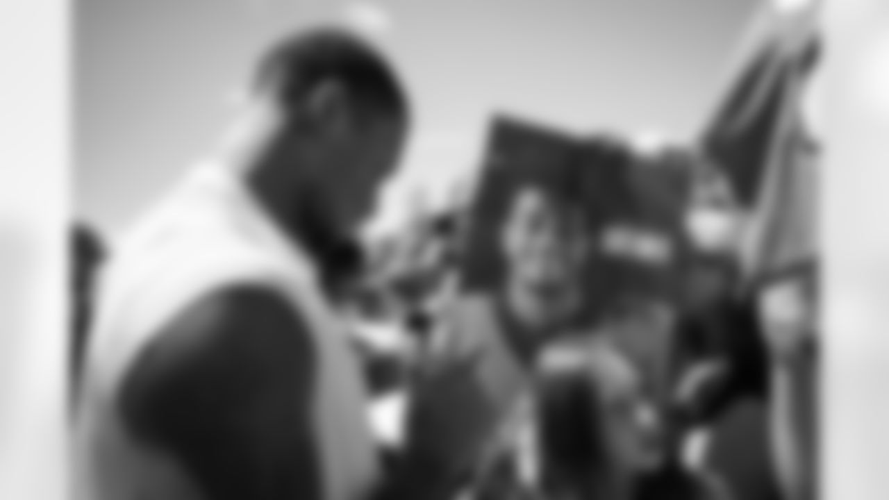 Pat Surtain II signs autographs for fans during a training camp practice at Centura Health Training Center on August 1, 2023 in Englewood, Colorado. Photo by Ben Swanson / Denver Broncos