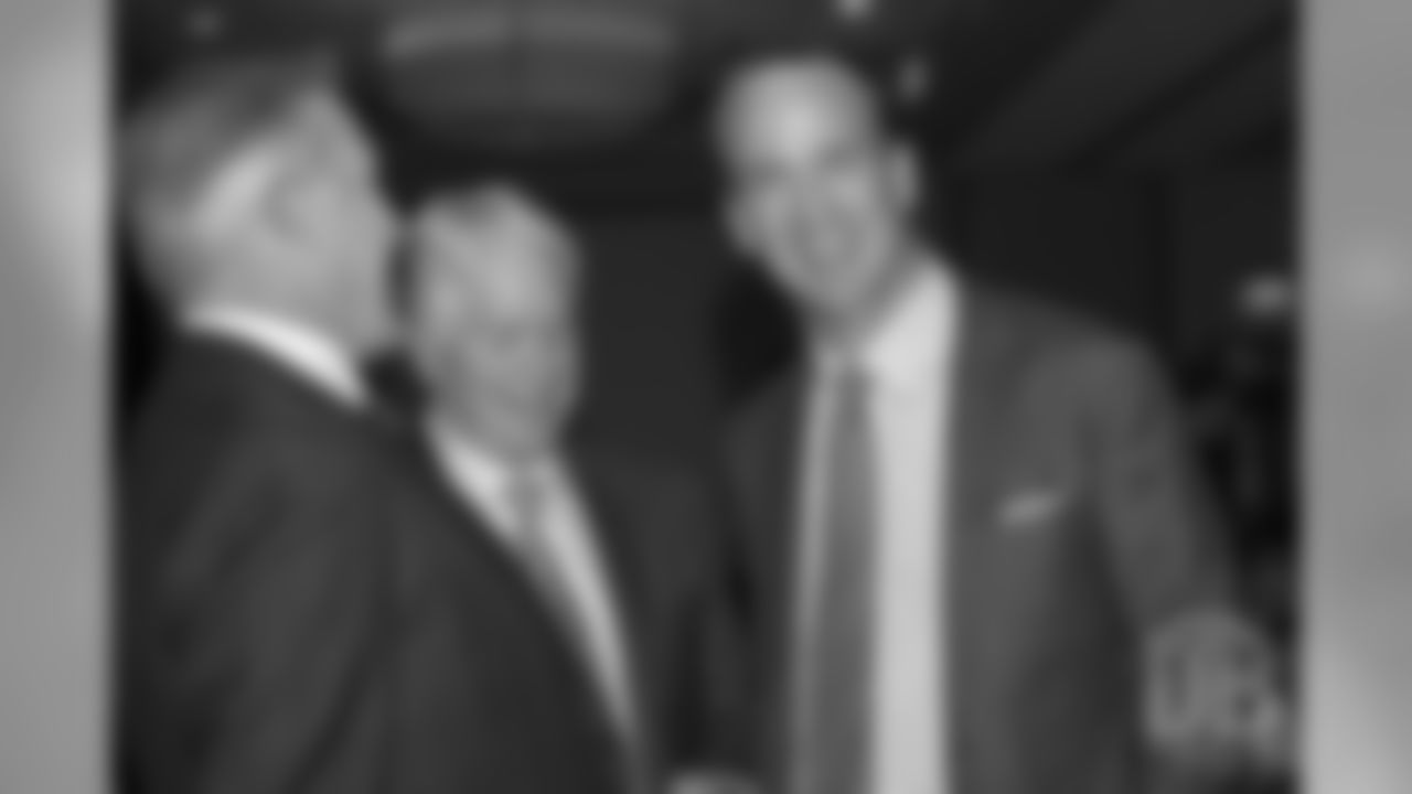 pictured: President of Football Operations/General Manager John Elway and Manning