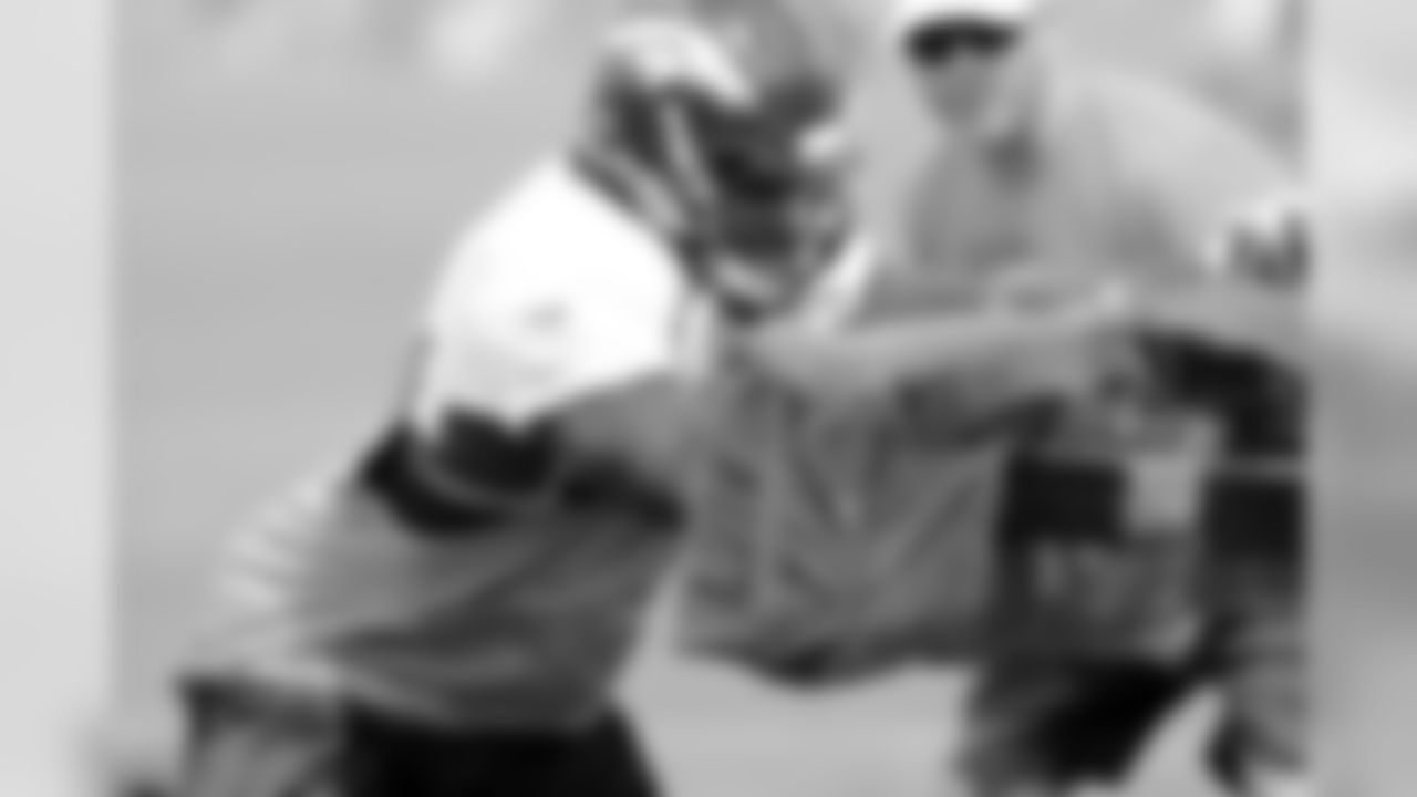 Outside linebacker DeMarcus Ware practices his blocking technique during his first training camp as a Bronco in 2014.
