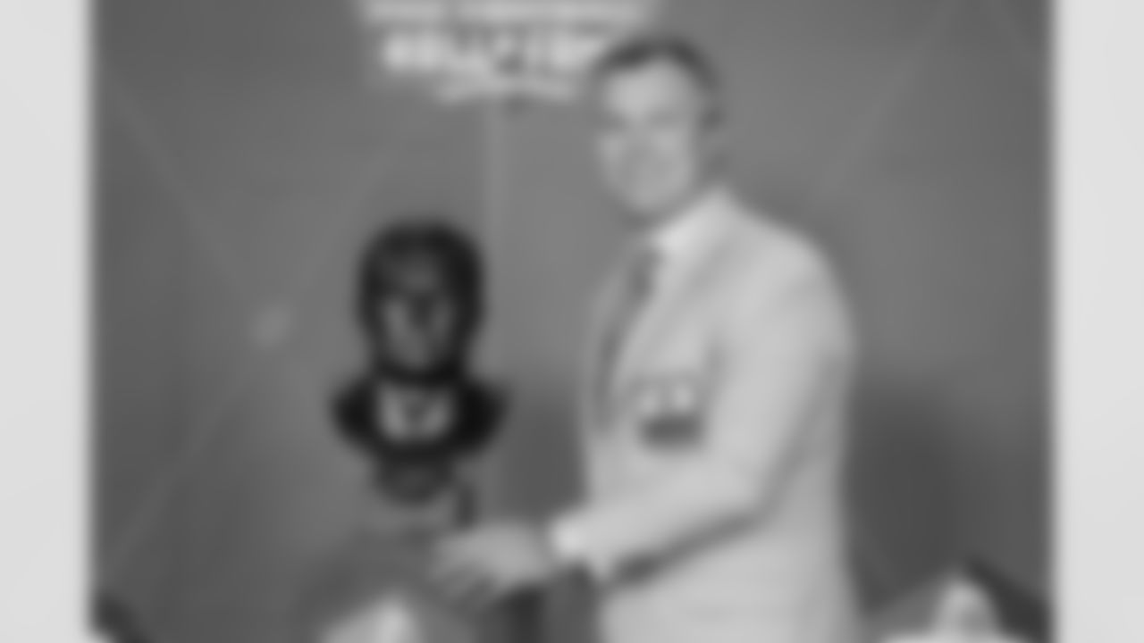 John Lynch stands next to bust during the 2021 Hall of Fame Weekend on Sunday, August 8, 2021 in Canton, Ohio. (Lauren Bacho/NFL)