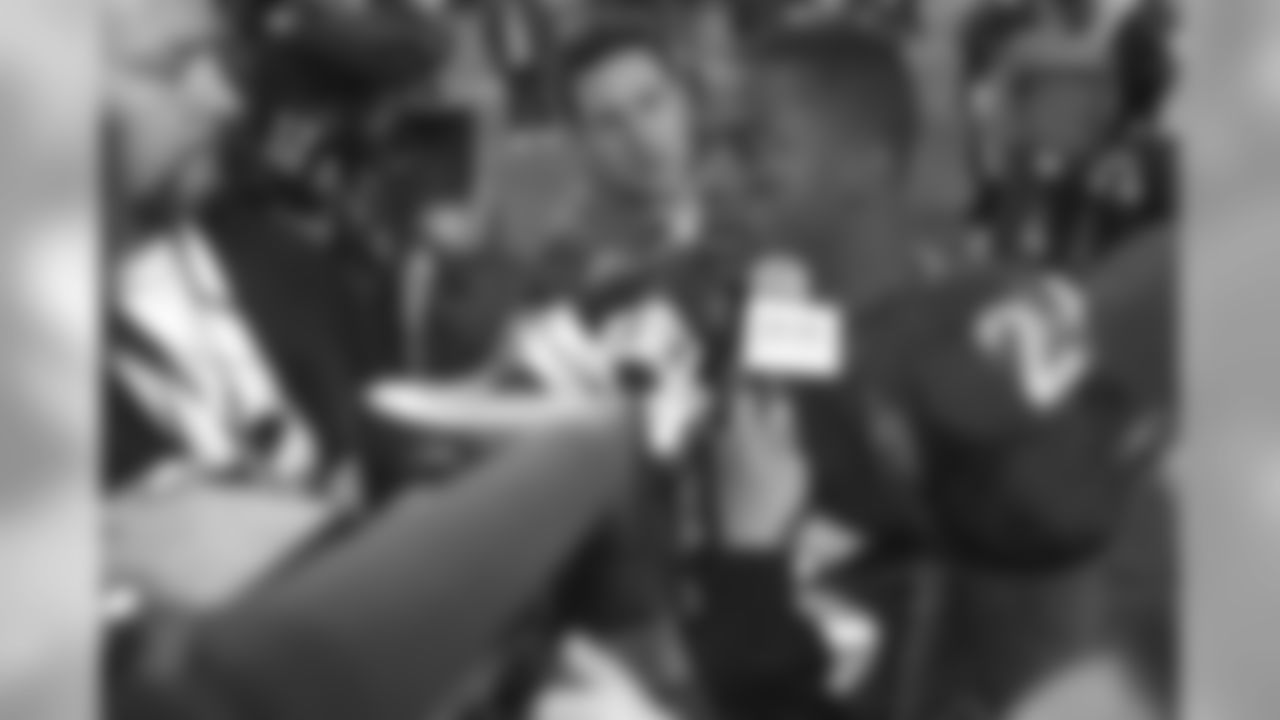 Clinton Portis answers questions from the media after his four-touchdown game against the Kansas City Chiefs at Invesco Field at Mile High in Denver, CO on December 15, 2002.