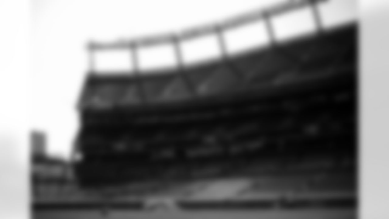 Members of the stadium's turf crew paint the field at Empower Field at Mile High on September 23, 2021 ahead of the team's Week 3 home opener. (Photo by Ben Swanson)