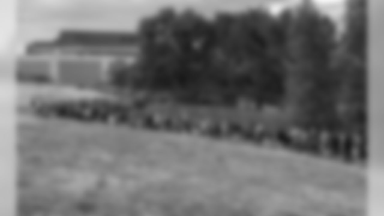 Fans line up for the first day of training camp on July 25, 2013.