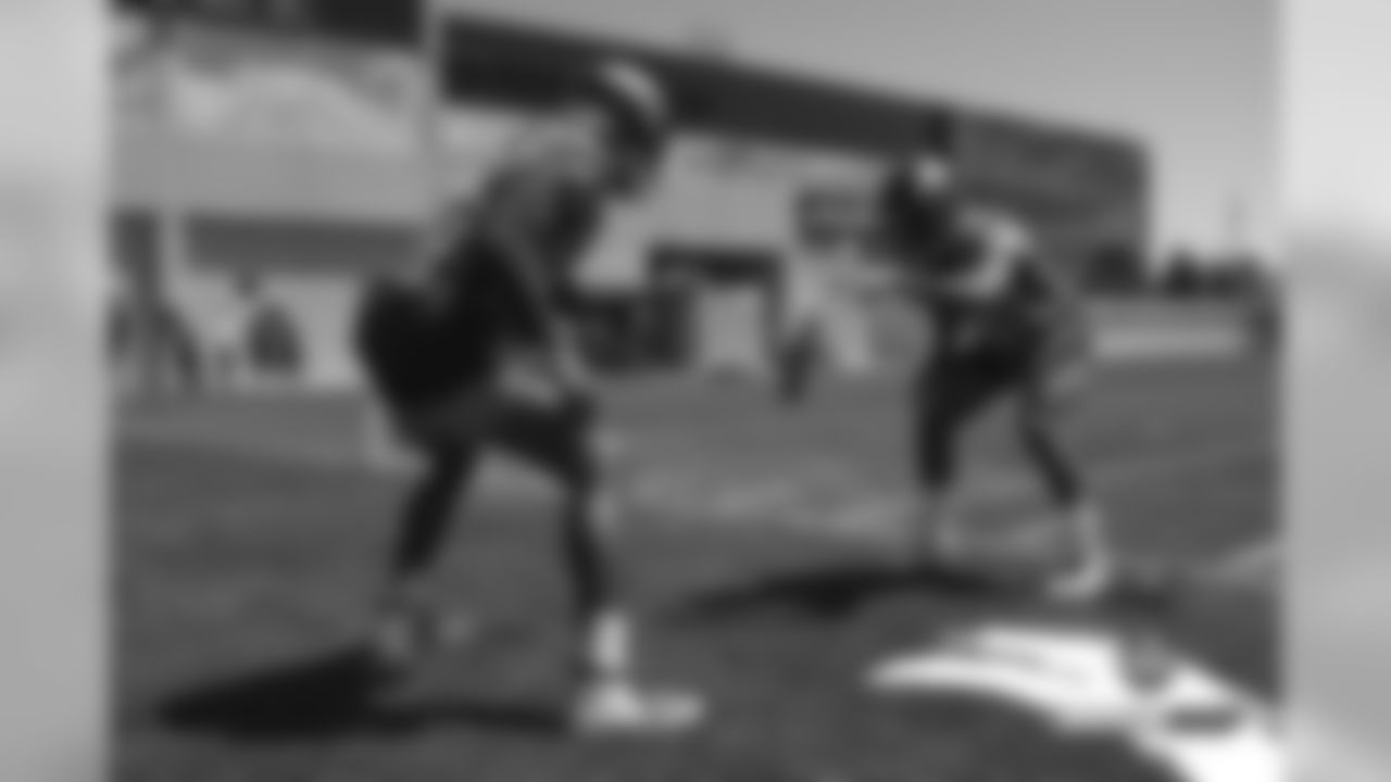 Courtland Sutton and Trinity Benson practice catching bricks to strengthen their hands at practice on the 18th day of training camp on August 15, 2019.
