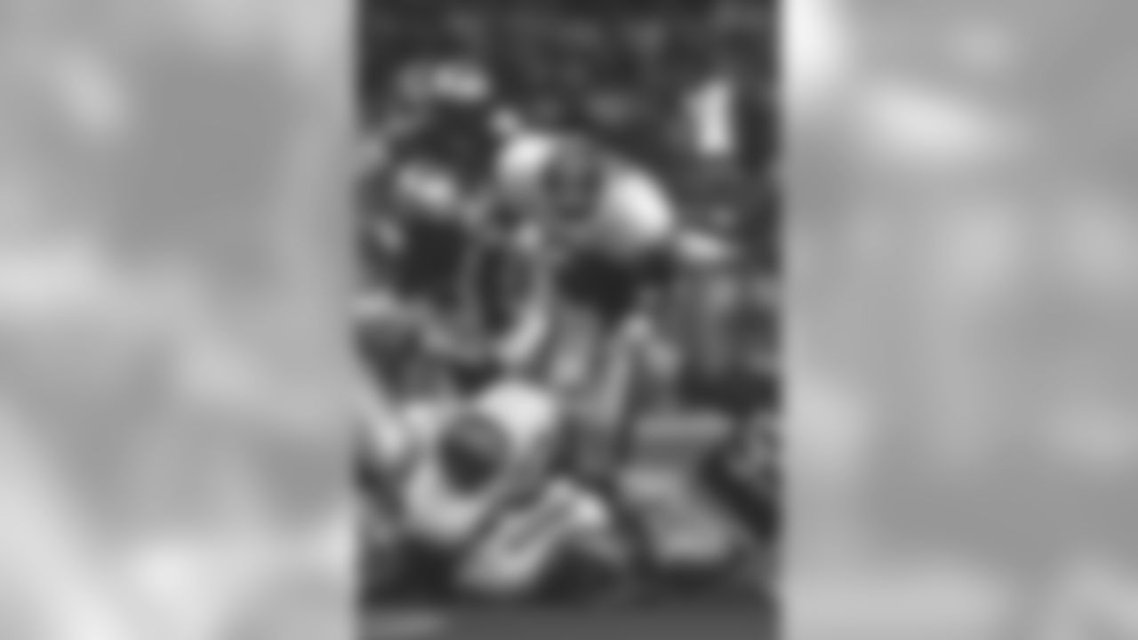 Running back Terrell Davis leaps over defenders during a September 8, 1996 win (30-20) over the Seattle Seahawks.