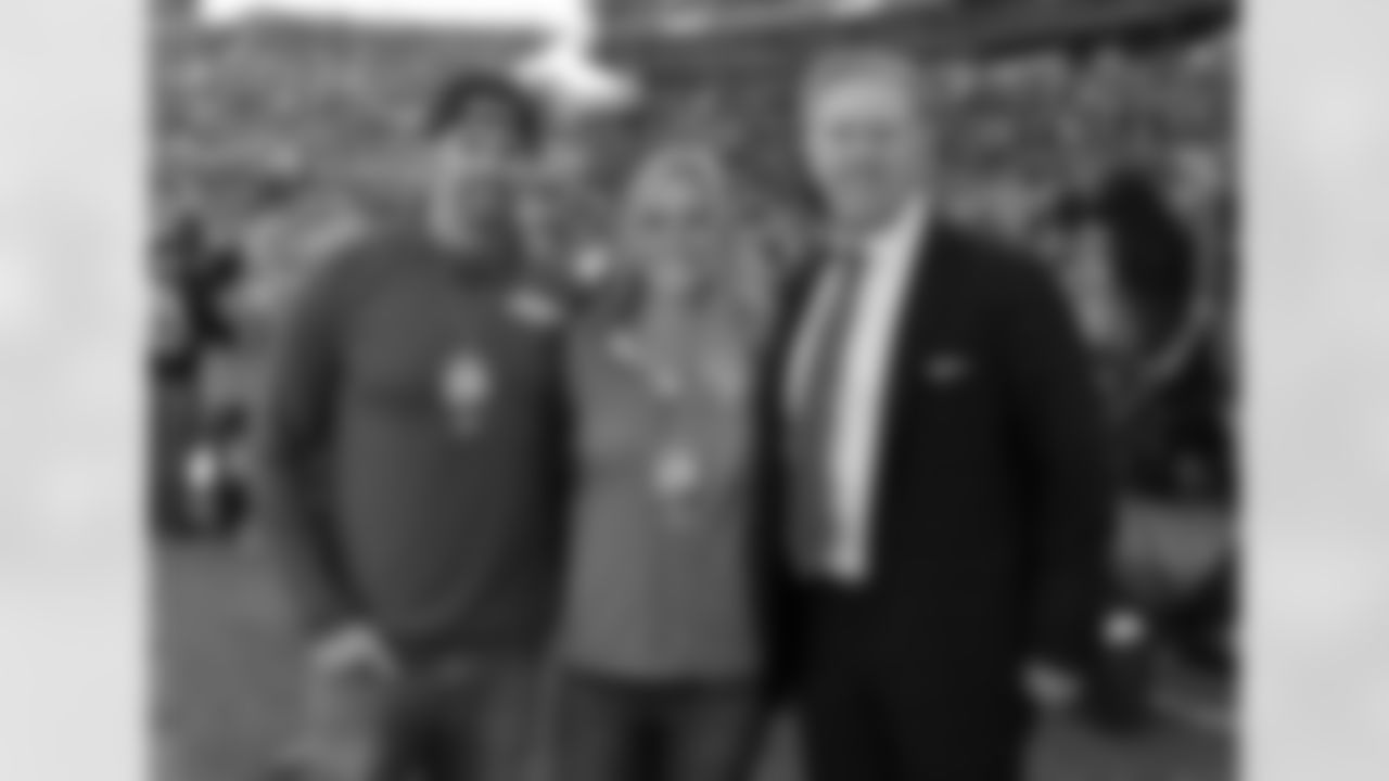 Holly Holm and John Elway