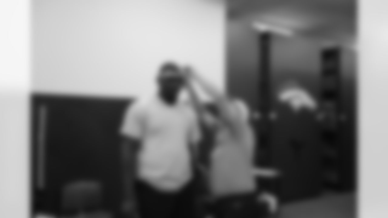 DE Malik Jackson gets his head measured for a helmet.