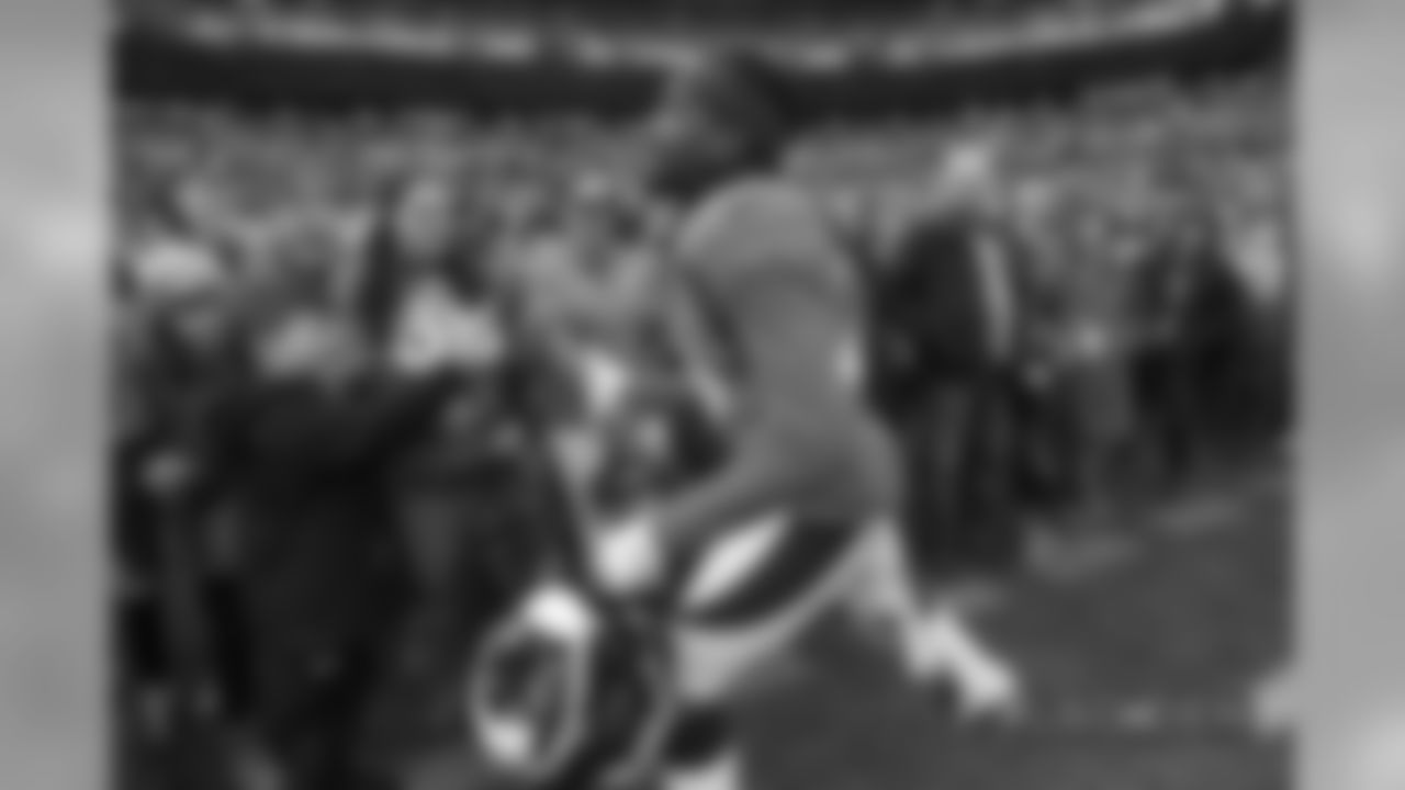 Bradley Roby high-fives fans before the Broncos' Week 17 game against the Los Angeles Chargers at Broncos Stadium at Mile High on December 30, 2018.