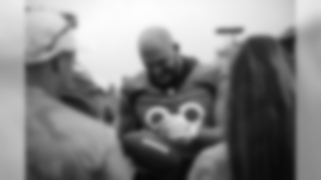 Adam Gotsis signs autographs for military members from the USAA Salute to Service NFL Boot Camp after practice on August 21, 2019 at UCHealth Training Center.