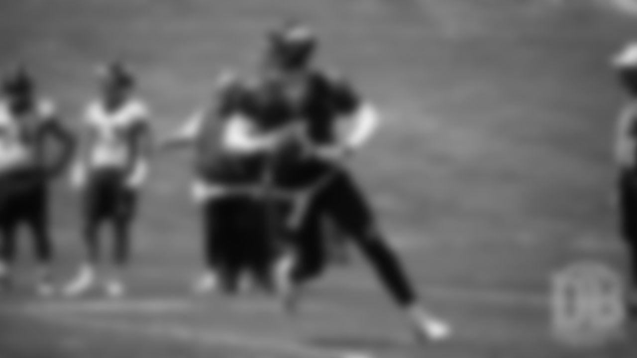 Drew Lock scrambles during the Broncos' practice on the eight day of their OTAs on May 30, 2019.