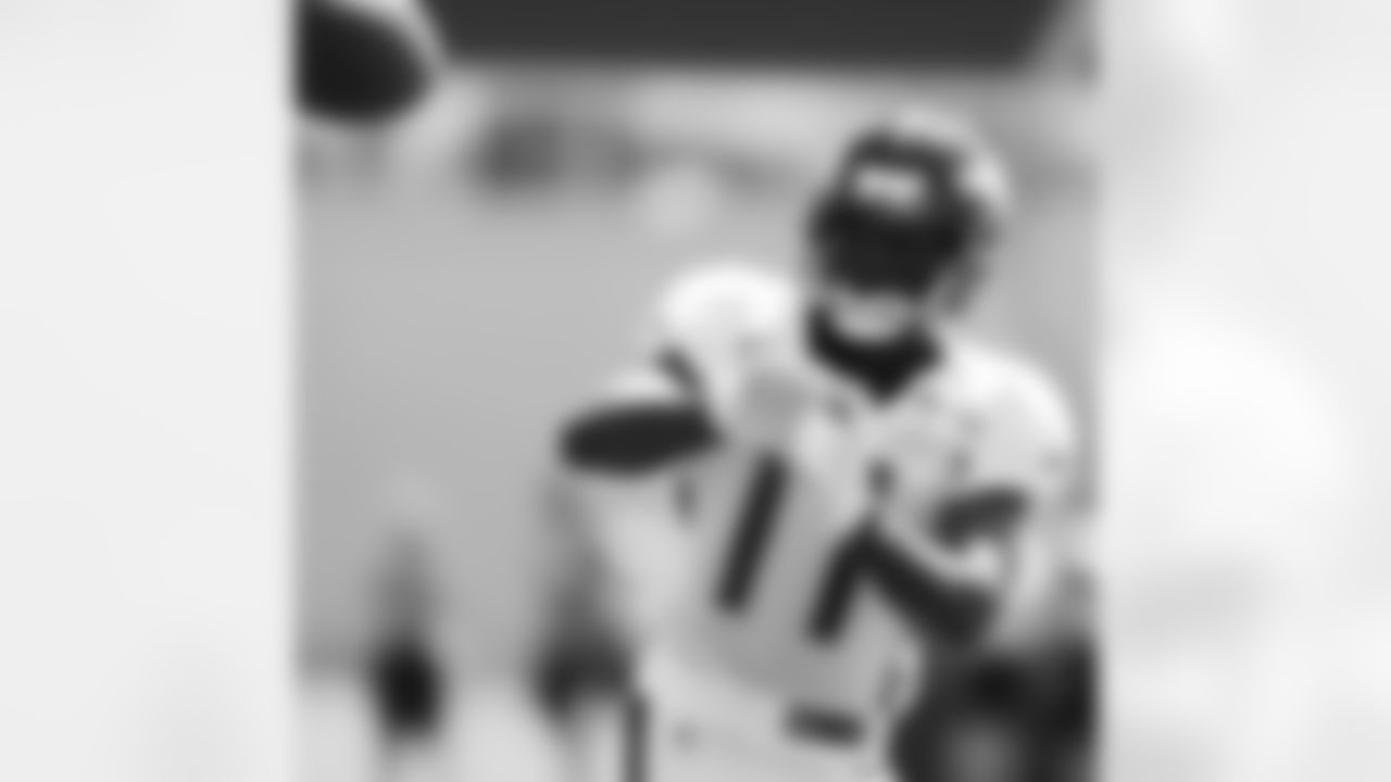 Holliday looks in a pass.