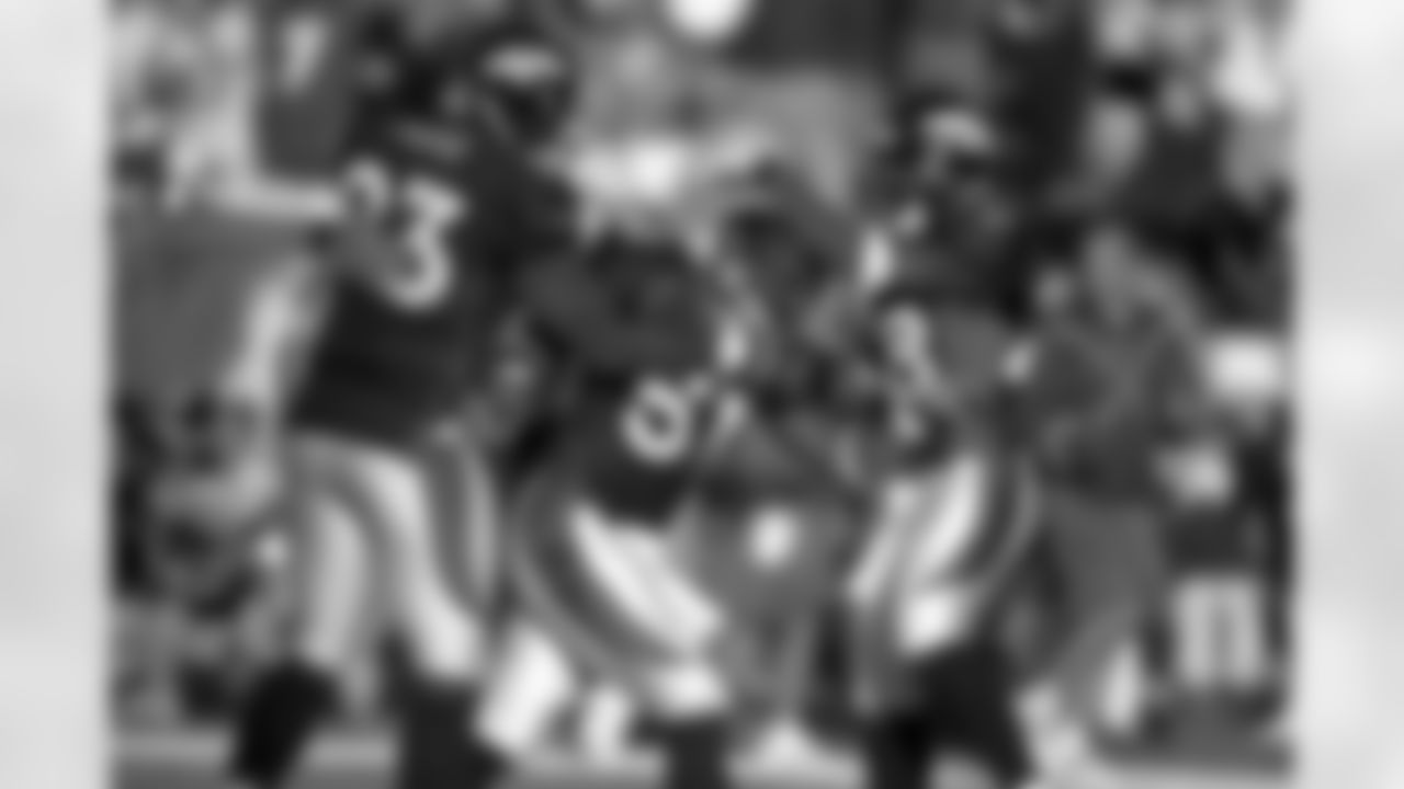 John Mobley celebrates with teammates after intercepting a pass against the San Diego Chargers at Invesco Field at Mile High in Denver, CO on November 11, 2001.