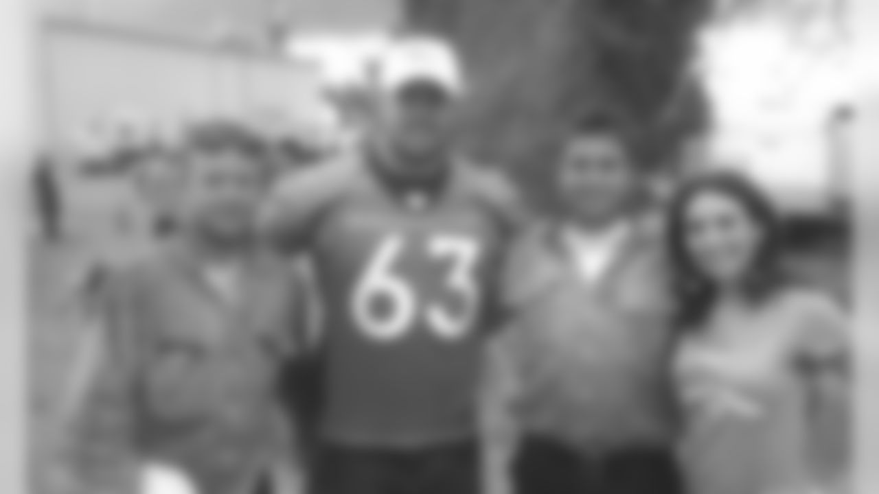 Broncos players and cheerleaders spend time with those affected by the High Park fire.