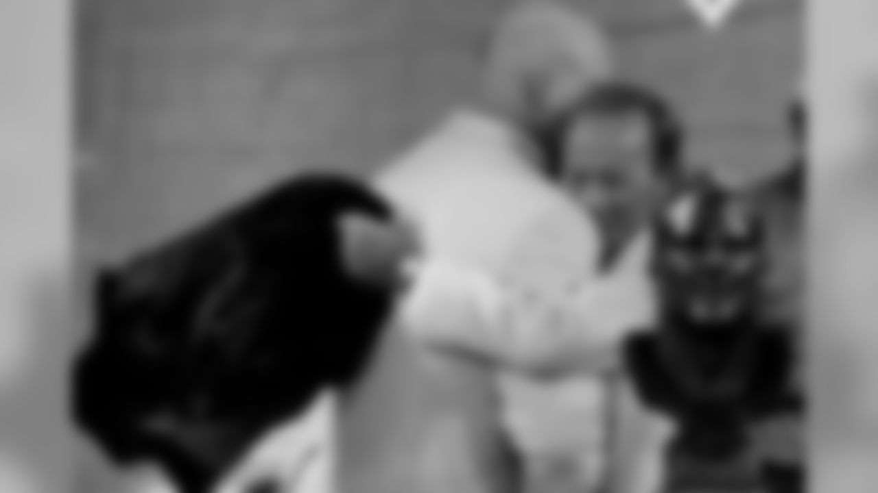 Bowlen embraces Zimmerman when the bust is revealed.