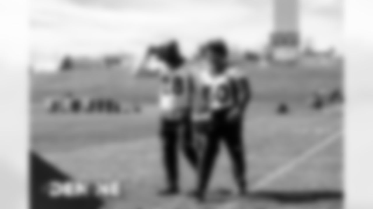 Royce Freeman and Phillip Lindsay walk off the field together after practice at UCHealth Training Center on October 16, 2020. (Photo by Ben Swanson)