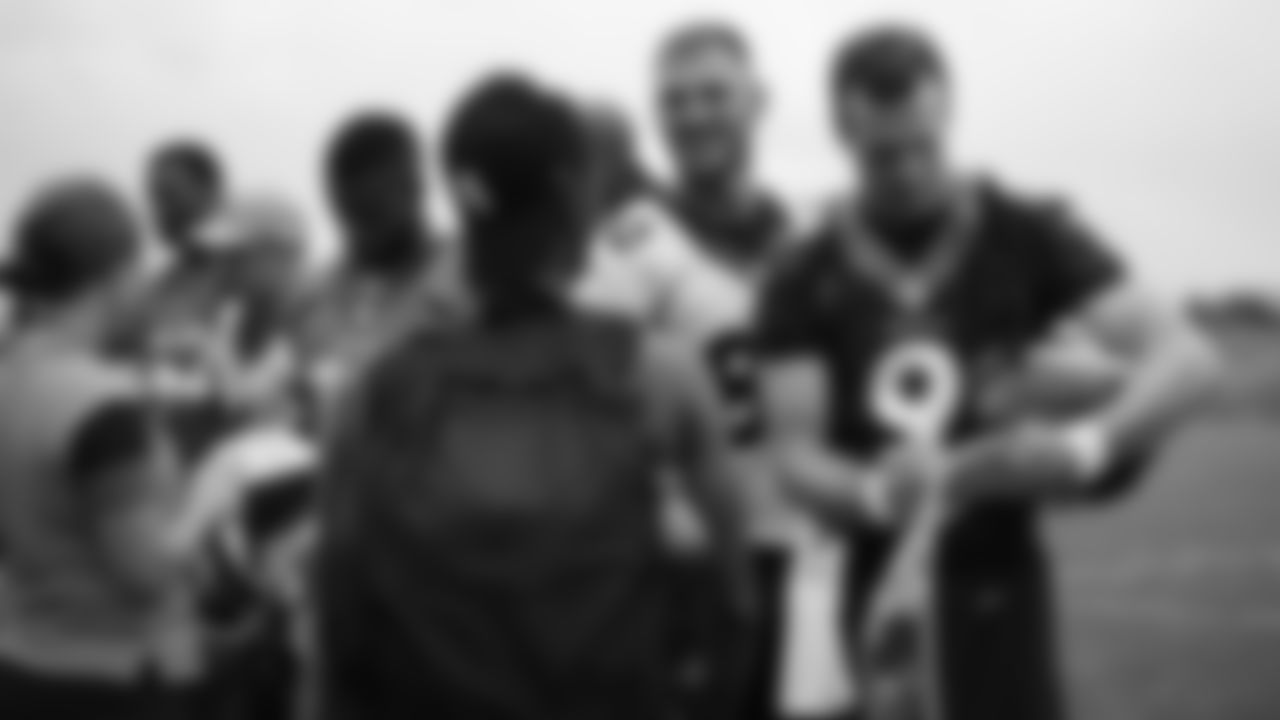 Jake Butt and Kevin Hogan signs autographs for military members from the USAA Salute to Service NFL Boot Camp after practice on August 21, 2019 at UCHealth Training Center.