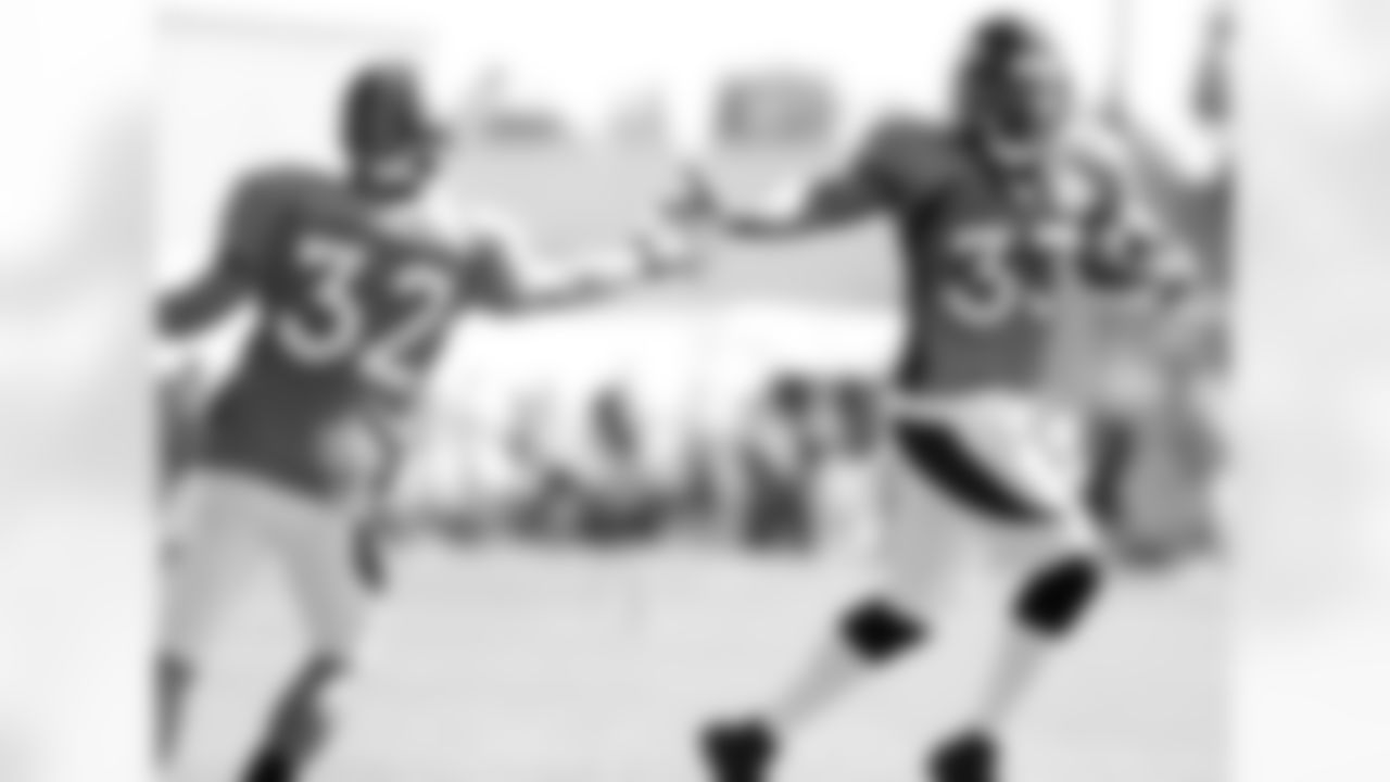 Iheancho and Carter celebrate after Iheancho strips Ball and recovers the fumble.