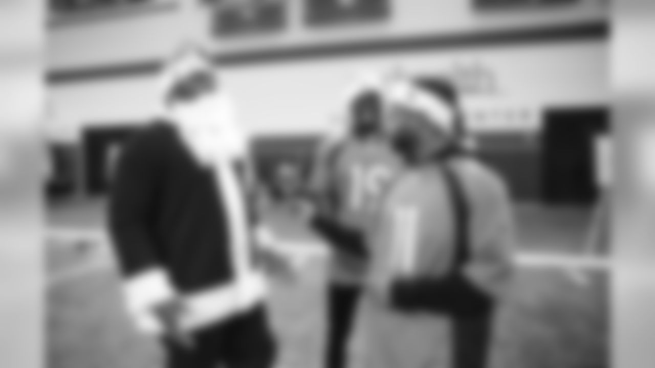 Shelby Harris, dressed as Santa Claus, talks with Fred Brown and Diontae Spencer at the 2019 Boys & Girls Club holiday party hosted by the Broncos for nearly 200 children from the Boys & Girls Clubs of Metro Denver on December 16, 2019 at UCHealth Training Center. (Photo by Jeremy Rincon)