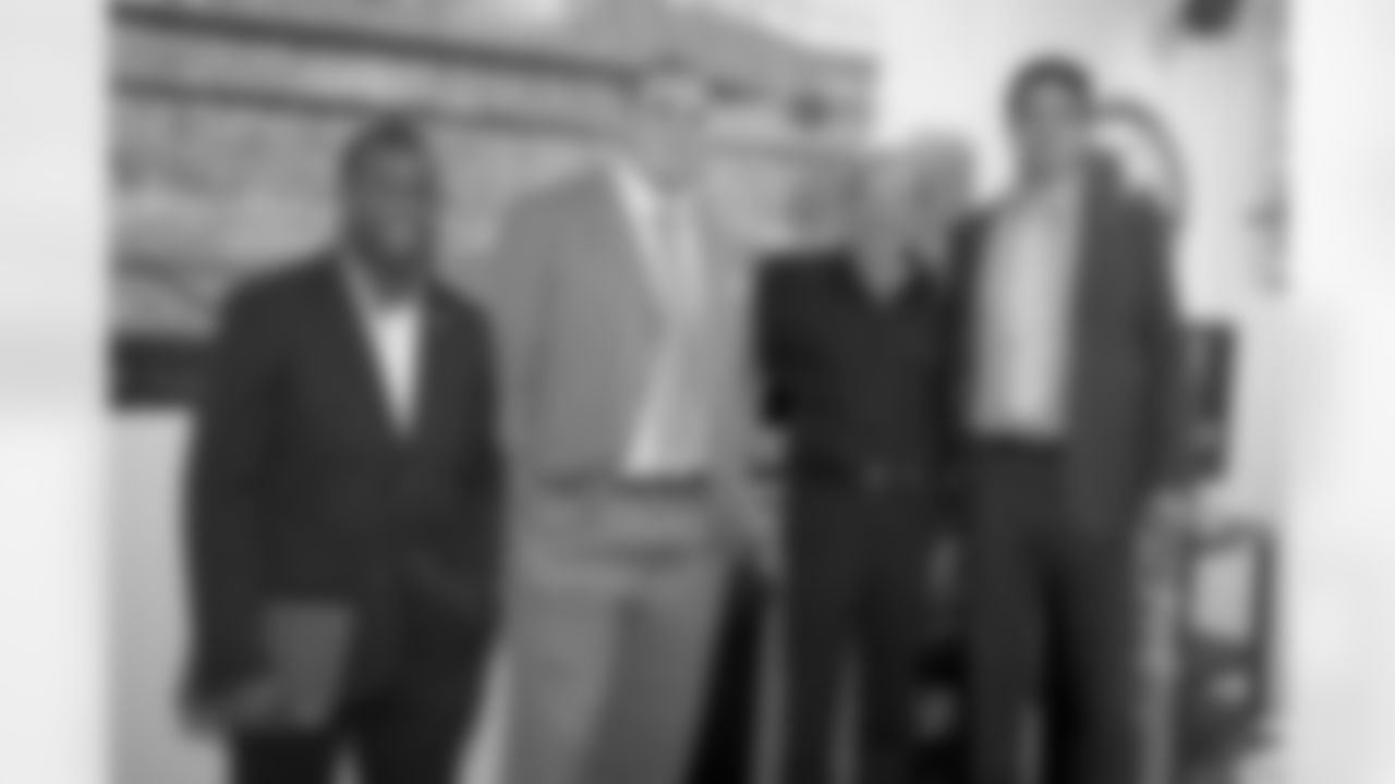 Denver Broncos draft picks Ronnie Hillman,Derek Wolfe and Brock Osweiller pose with owner Pat Bowlen,third from left, arrival at Dove ValleyApril 28, 2012 in Englewood,CO.