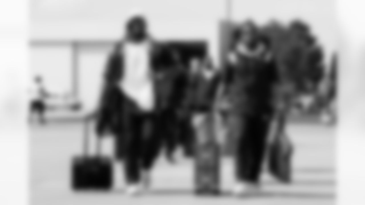 Von Miller and Kareem Jackson on the tarmac at Denver International Airport on September 11, 2021 during the team's travel to New York for a Week 1 game against the Giants. (Photo by Joe Abdellah)