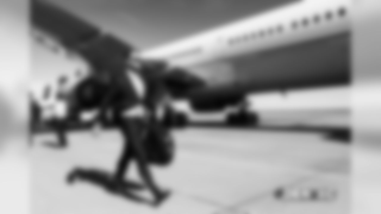 Colby Wadman walks on the tarmac to the plane before the flight during the team's travel for their Week 8 game against the Kansas City Chiefs on October 27, 2018.