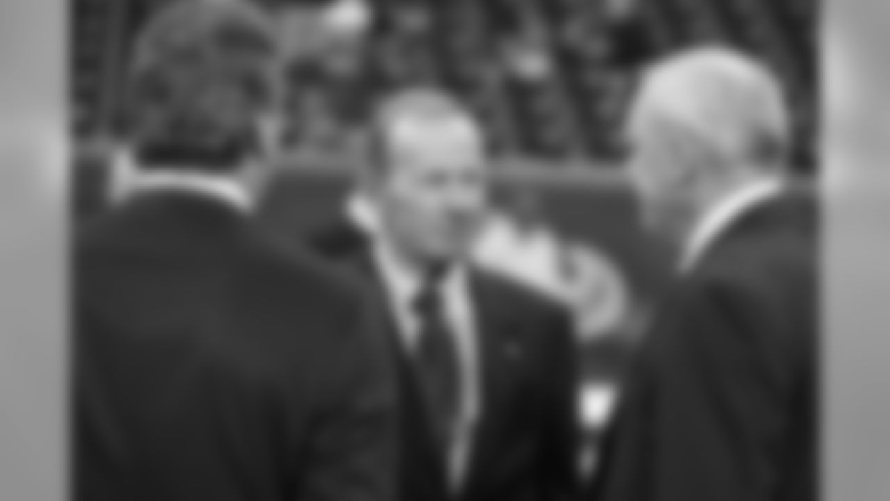 Denver Broncos President and CEO Pat Bowlen chats with Houston Texans owner Bob McNair, right, and son Cal prior to the game at Reliant Stadium.