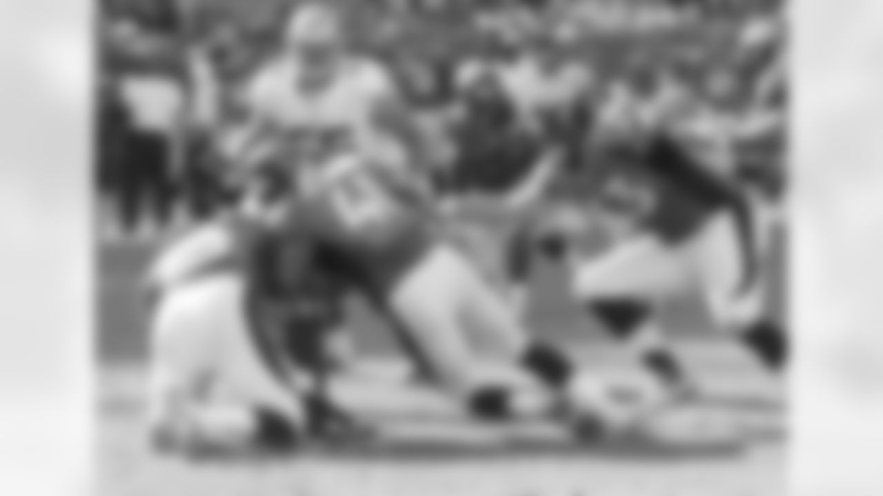 Denver's defense makes a tackle.