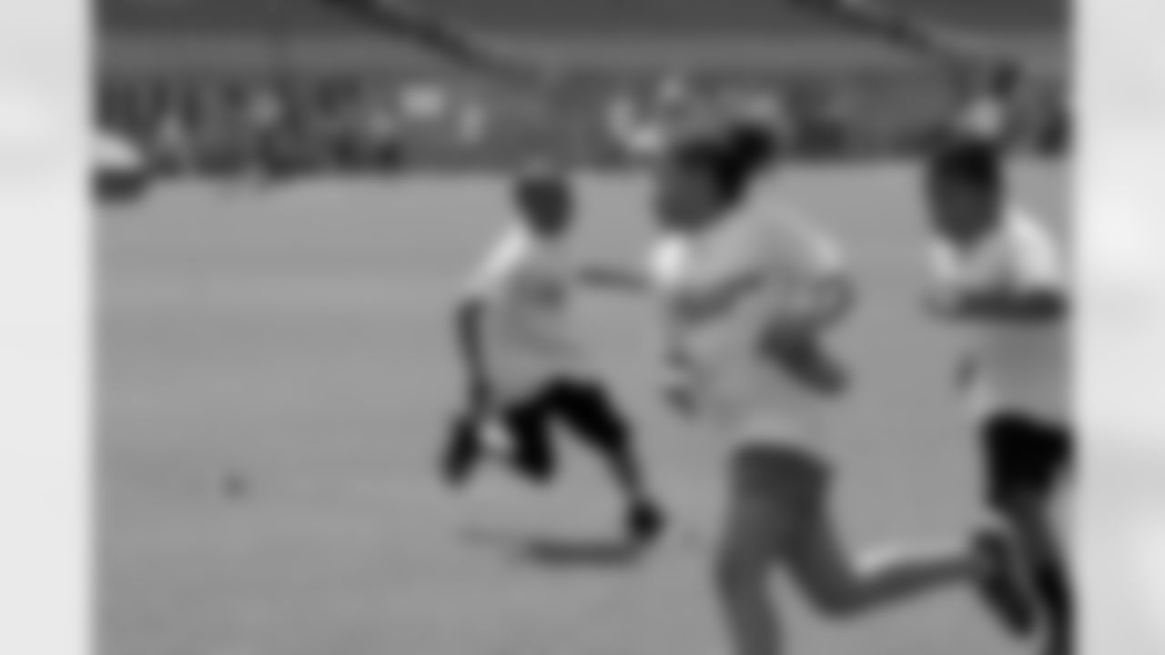 Kids of all ages participated in a series of drills to help them learn and understand proper football fundamentals.