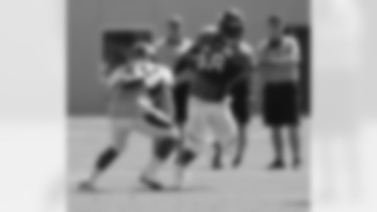 Miller rushes the "passer" during a drill.