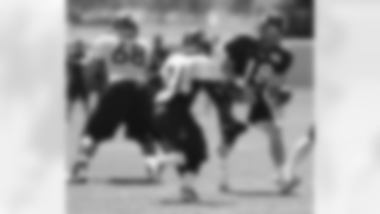 Manning hands to Hillman.