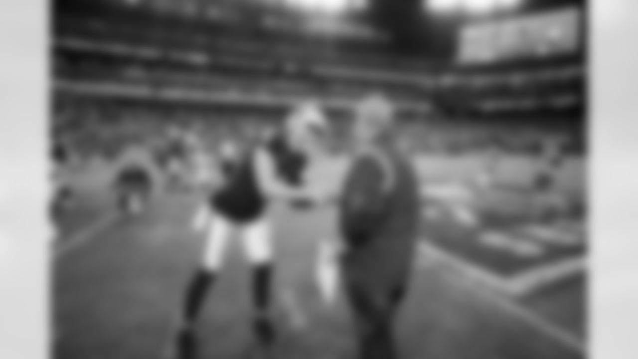 Head Coach Vic Fangio and Derek Carr during the Broncos' Week 16 game against the Las Vegas Raiders at Allegiant Stadium in Las Vegas, Nevada on December 26, 2021. (Photo by Gabriel Christus)