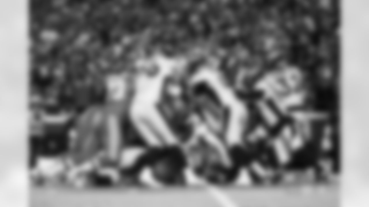Zach Allen, Matt Henningsen, Jonathon Cooper and others during the Broncos' Week 6 game against the Kansas City Chiefs at GEHA Field at Arrowhead Stadium in Kansas City, Missouri on October 12, 2023. Photo by Ben Swanson / Denver Broncos